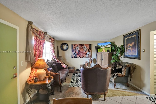 tiled living room with a textured ceiling