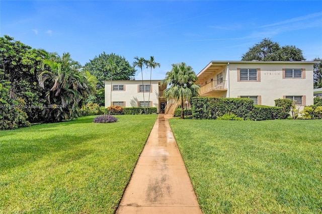 view of front of home with a front lawn