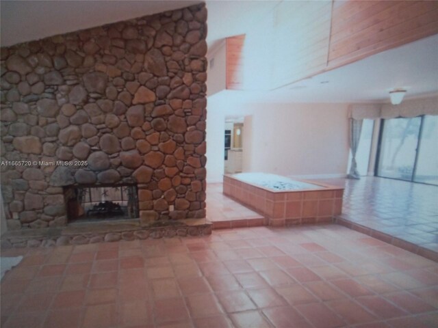 view of swimming pool with ceiling fan, glass enclosure, and a patio