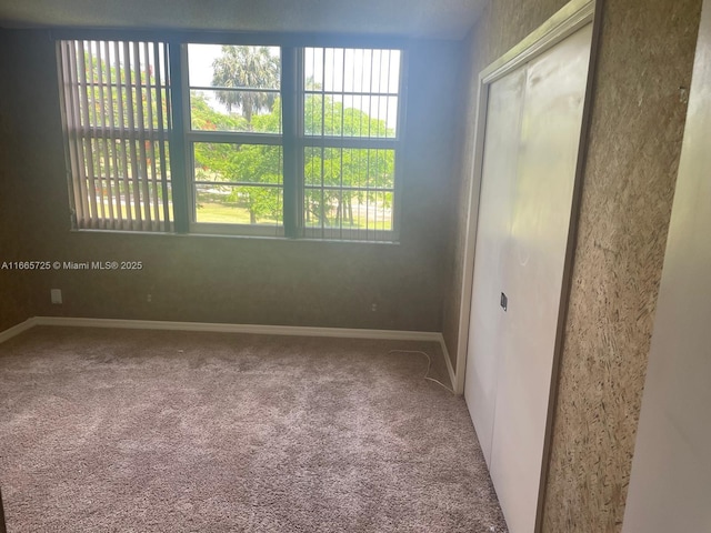 3520 Oaks Way Unit 208, Pompano Beach, FL 33069 - carpeted spare room with baseboards and a water view