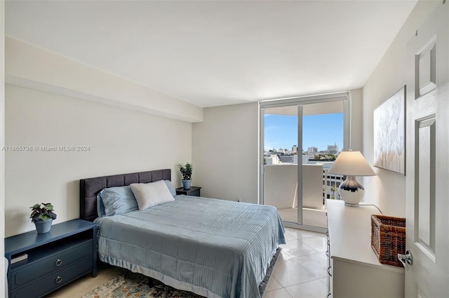 tiled bedroom featuring access to exterior