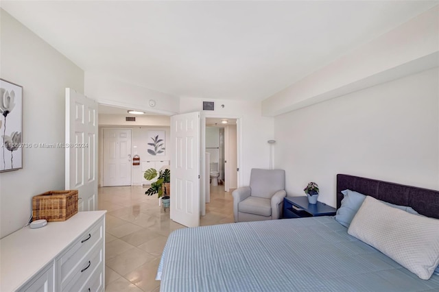 bedroom featuring light tile patterned floors