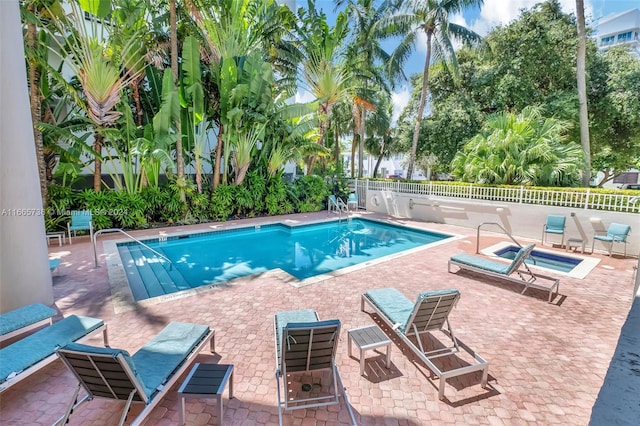 view of swimming pool with a patio area