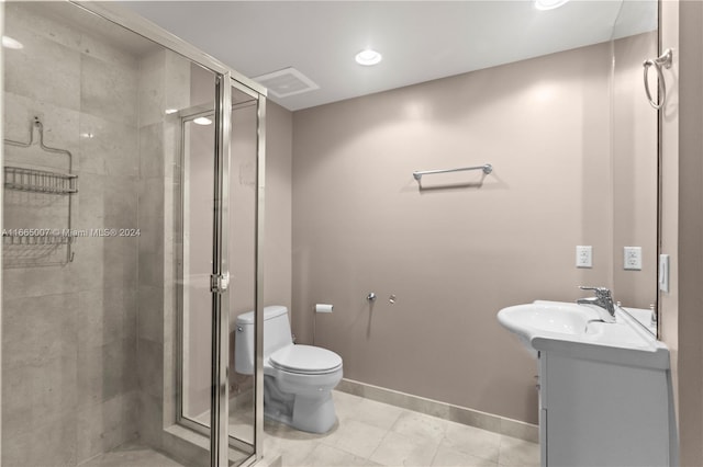 bathroom featuring vanity, toilet, tile patterned floors, and an enclosed shower