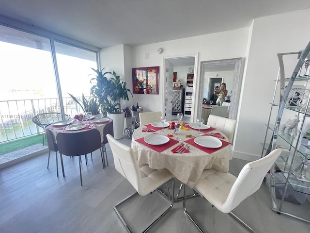 dining area with hardwood / wood-style flooring