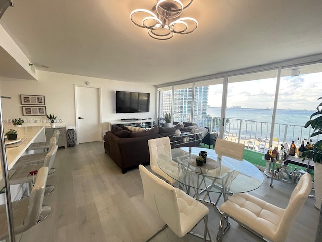 living room featuring floor to ceiling windows and light hardwood / wood-style flooring