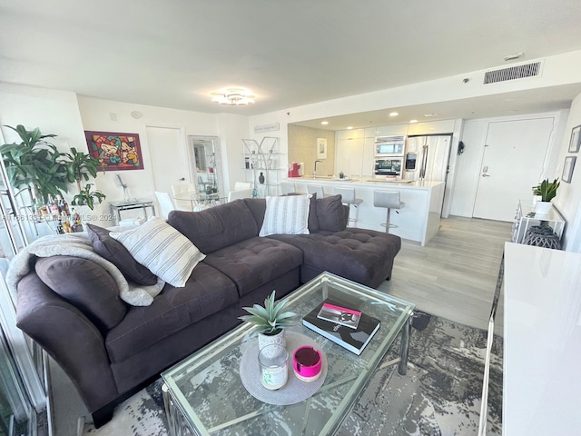 living room with light hardwood / wood-style floors