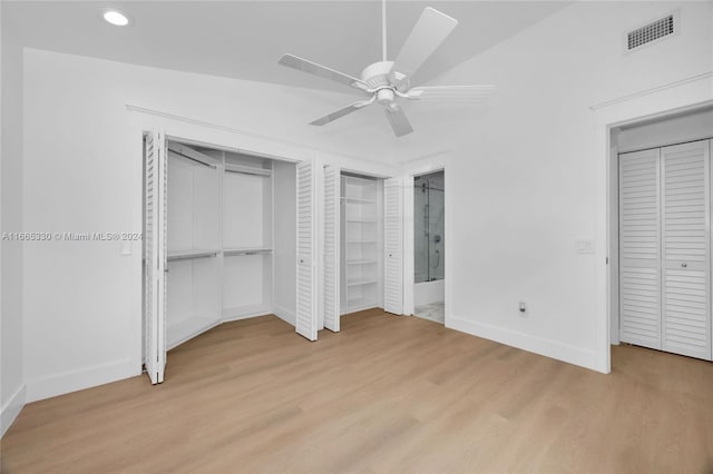 unfurnished bedroom featuring light hardwood / wood-style floors, lofted ceiling, and ceiling fan