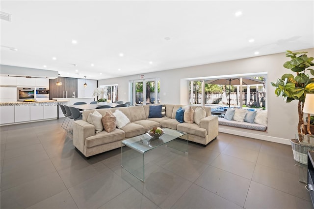 living room with tile patterned floors