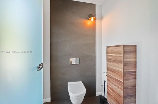 bathroom with tile patterned flooring and toilet