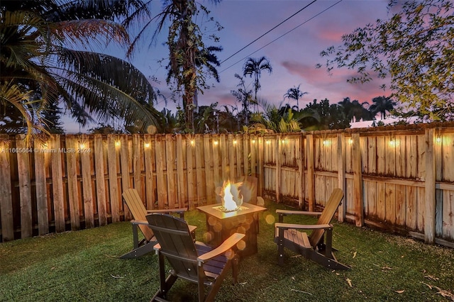 view of yard at dusk