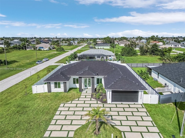 view of front facade with a garage and a front yard