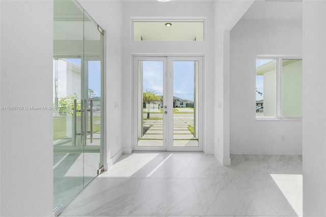 entryway featuring french doors and a wealth of natural light