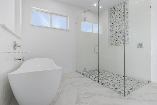 bathroom with shower with separate bathtub