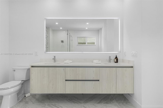 bathroom with walk in shower, vanity, and toilet