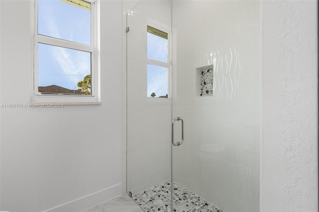 bathroom with an enclosed shower