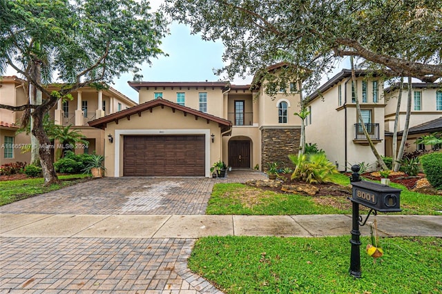 mediterranean / spanish house featuring a garage