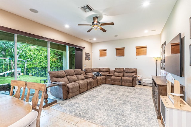 tiled living room with ceiling fan