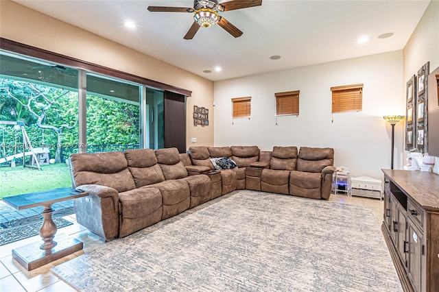 tiled living room with ceiling fan