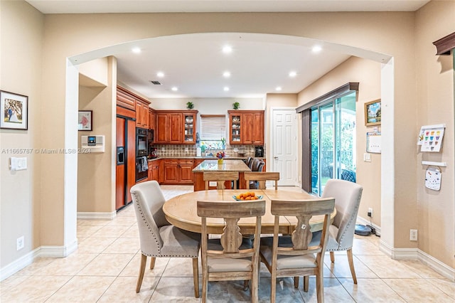 dining area with light tile patterned floors