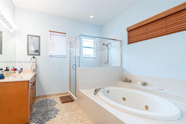 bathroom with vanity, shower with separate bathtub, and tile patterned floors