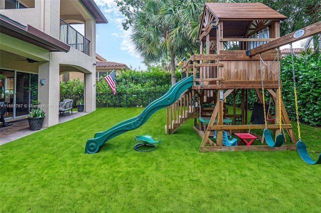 view of playground with a lawn