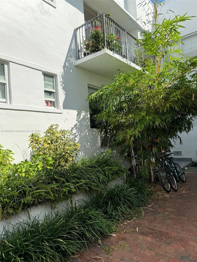 view of side of property with a balcony