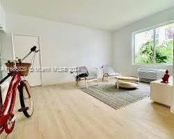 living area with wood-type flooring