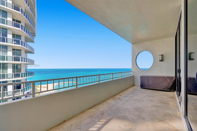 balcony featuring a water view