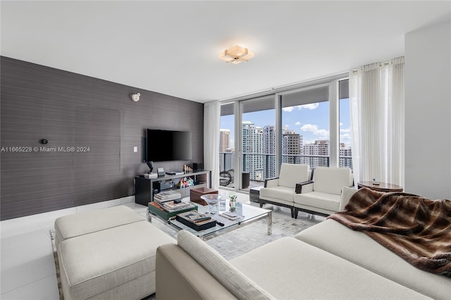 living room featuring a wall of windows