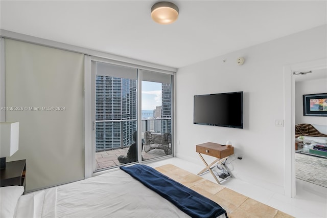 tiled bedroom featuring access to exterior