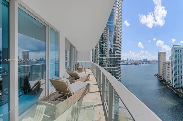 balcony featuring a water view