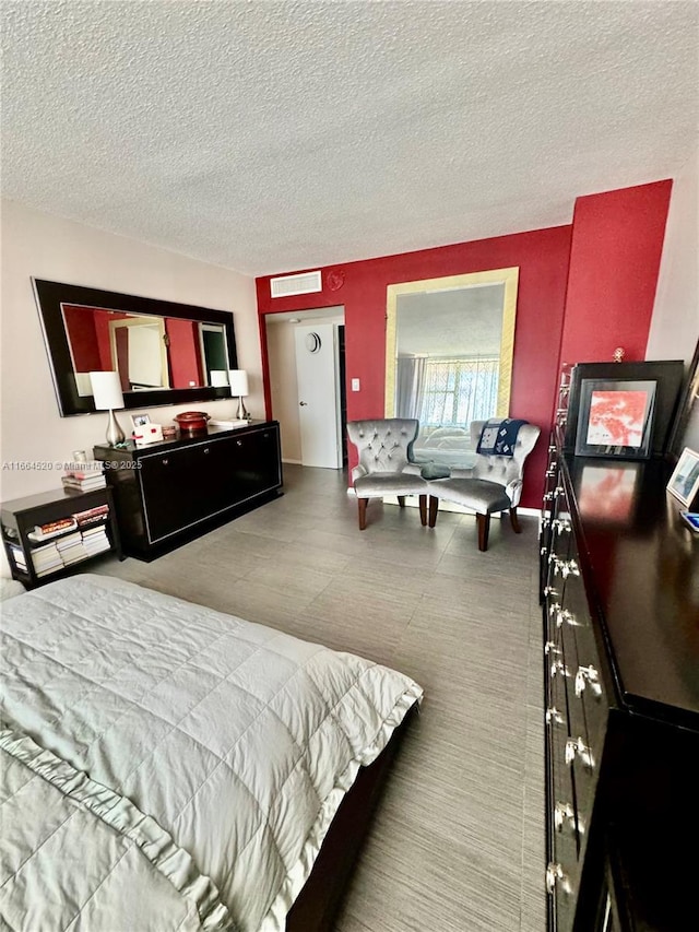 bedroom featuring a textured ceiling