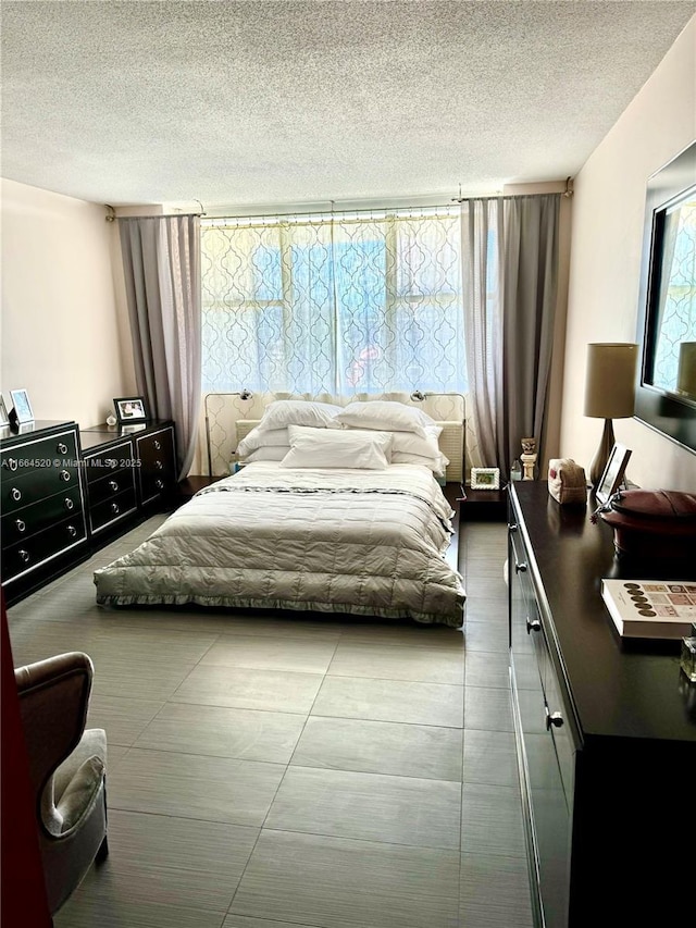 bedroom featuring a textured ceiling