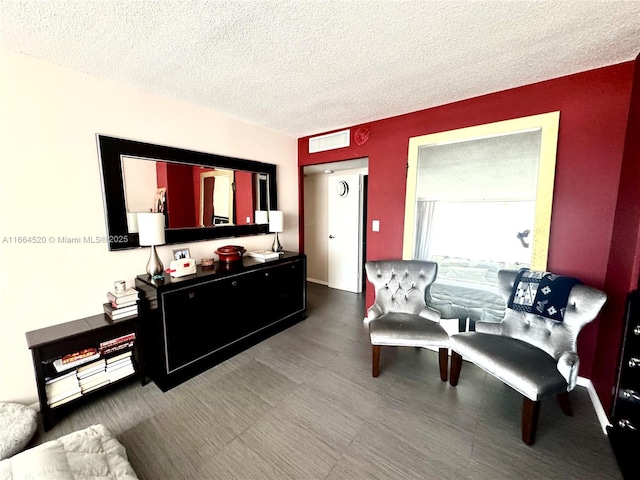 living room featuring a textured ceiling