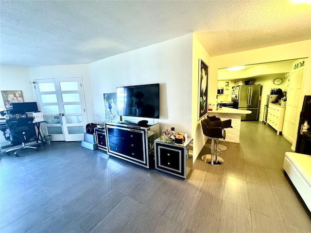 living room with a textured ceiling