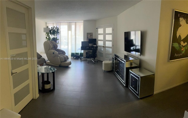 living room featuring a wall of windows