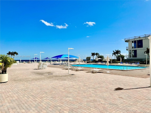 view of pool with pool water feature