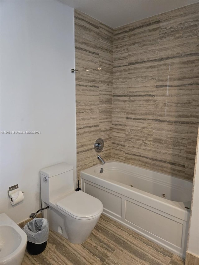 bathroom featuring wood-type flooring and toilet