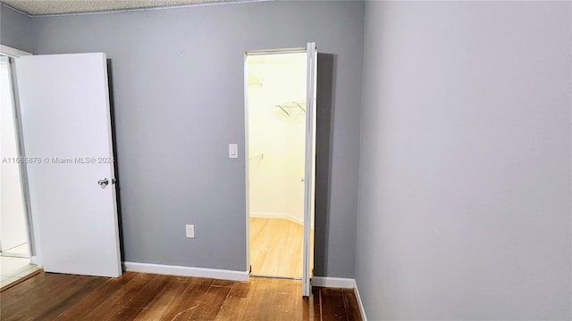 unfurnished room featuring hardwood / wood-style flooring