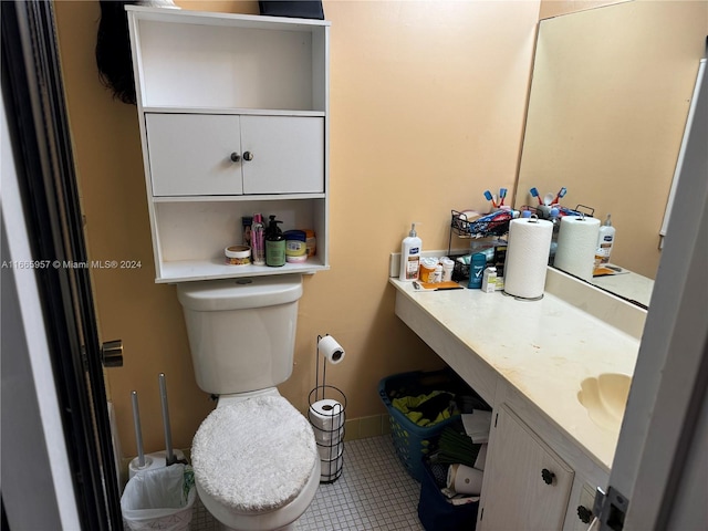 bathroom with tile patterned floors, vanity, and toilet