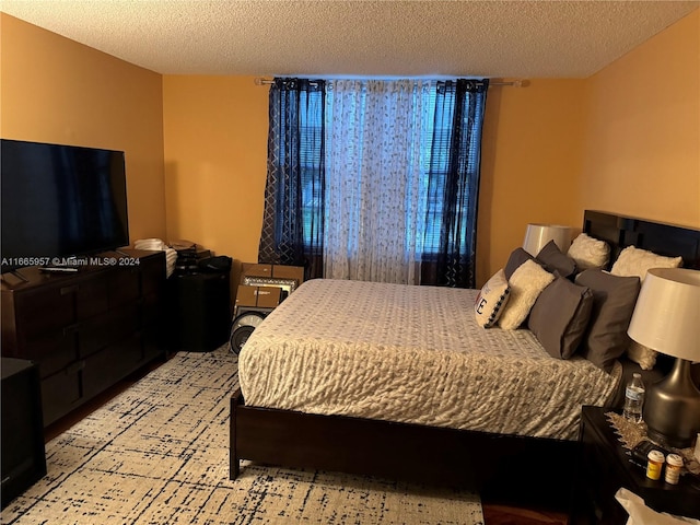 bedroom featuring a textured ceiling