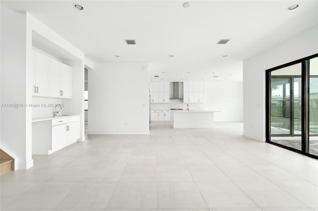 8095 Crystal Downs Ave, Boca Raton, FL 33434 - unfurnished living room featuring light tile patterned flooring and recessed lighting