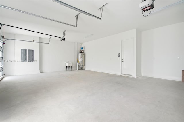 garage featuring gas water heater, a garage door opener, and electric panel