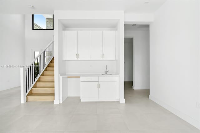 8095 Crystal Downs Ave, Boca Raton, FL 33434 - stairs featuring bar with sink and baseboards