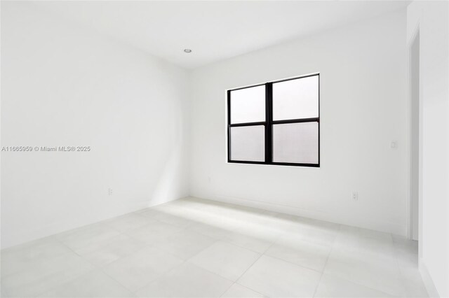8095 Crystal Downs Ave, Boca Raton, FL 33434 - spare room with light tile patterned flooring