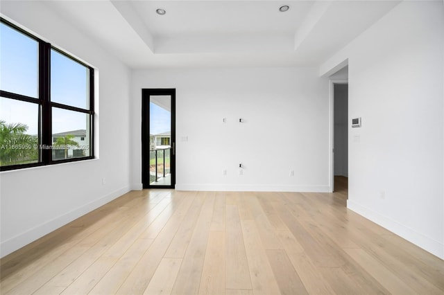 8095 Crystal Downs Ave, Boca Raton, FL 33434 - spare room with a raised ceiling and light wood finished floors