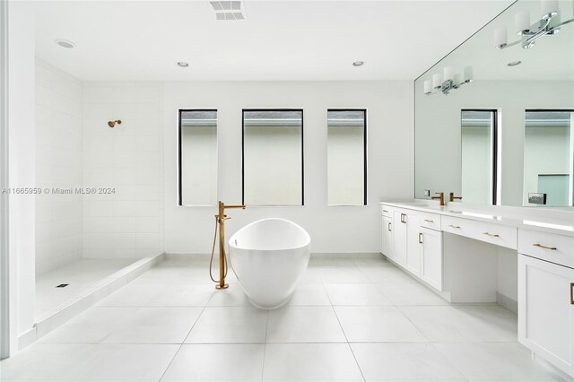 bathroom featuring vanity, separate shower and tub, and tile patterned floors