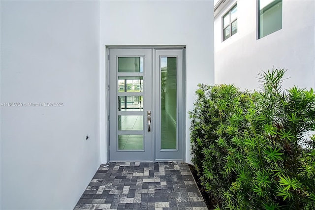 8095 Crystal Downs Ave, Boca Raton, FL 33434 - doorway to property featuring stucco siding