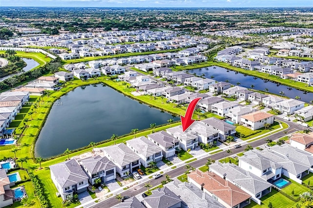 birds eye view of property with a water view